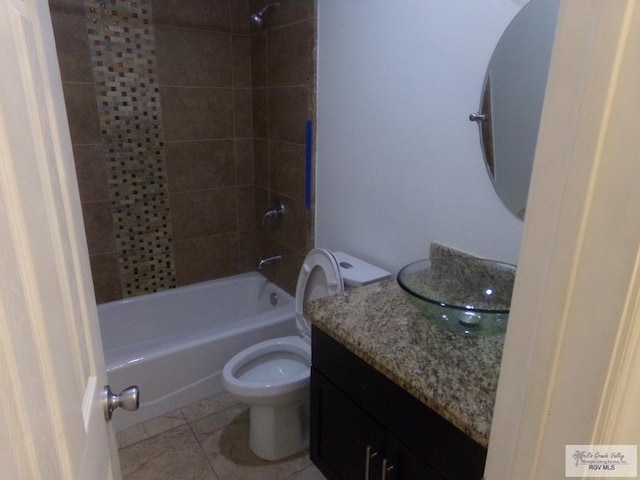 full bathroom with tile patterned floors, vanity, toilet, and tiled shower / bath