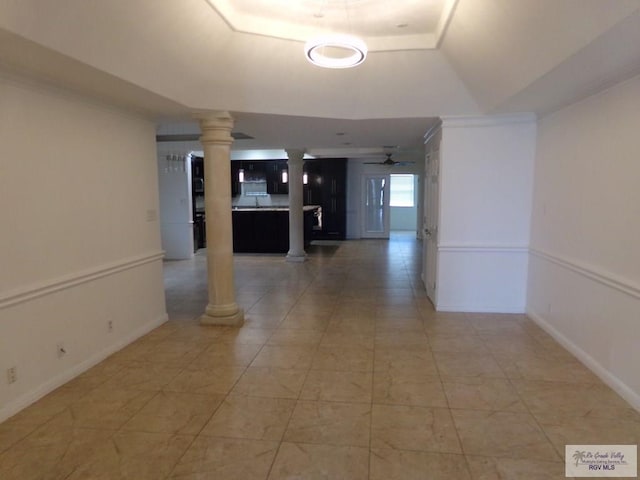 hallway with a raised ceiling