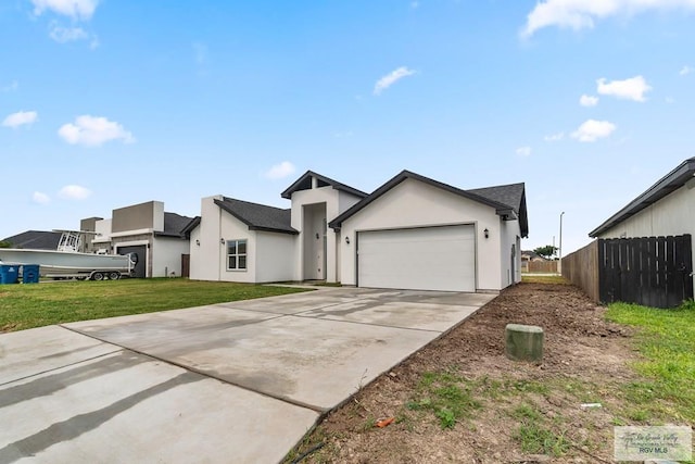 6221 King Palm Loop, Brownsville, TX 78526 - view of front of home with driveway, stucco siding, and an attached garage