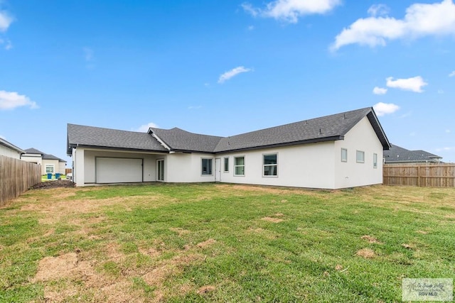 6221 King Palm Loop, Brownsville, TX 78526 - back of property featuring a garage and stucco siding