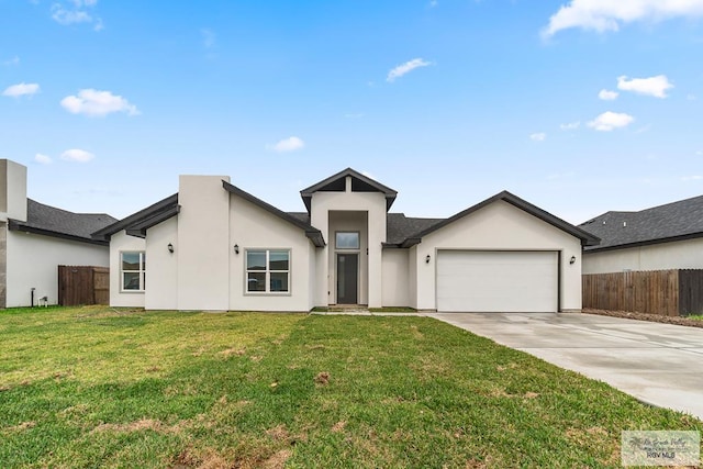 6221 King Palm Loop, Brownsville, TX 78526 - view of front facade with driveway, an attached garage, and stucco siding