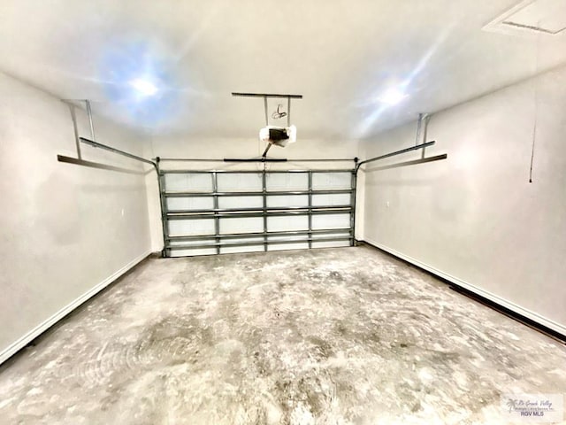 garage featuring baseboards and a garage door opener