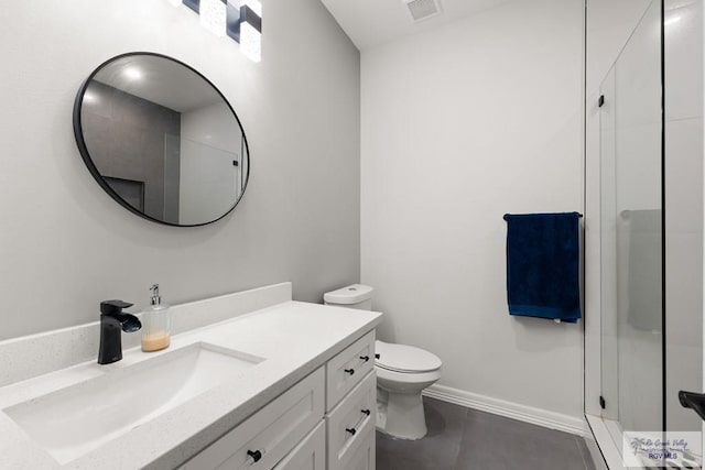 bathroom featuring tile patterned floors, vanity, toilet, and an enclosed shower