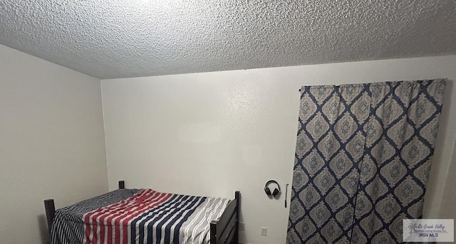 bedroom featuring a textured ceiling