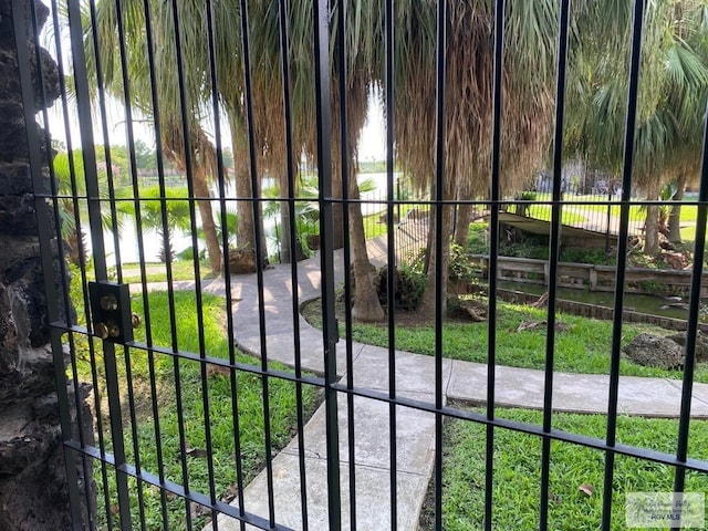 view of gate with a water view