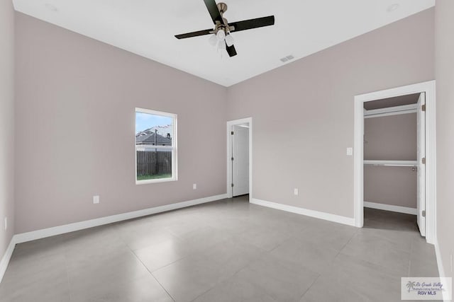 unfurnished bedroom featuring ceiling fan and light tile patterned floors