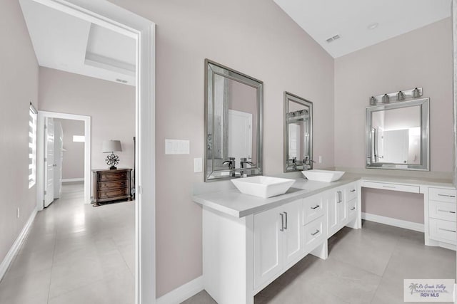 bathroom featuring tile patterned flooring and vanity