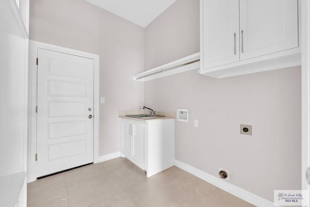 laundry area featuring sink, cabinets, washer hookup, electric dryer hookup, and light tile patterned flooring