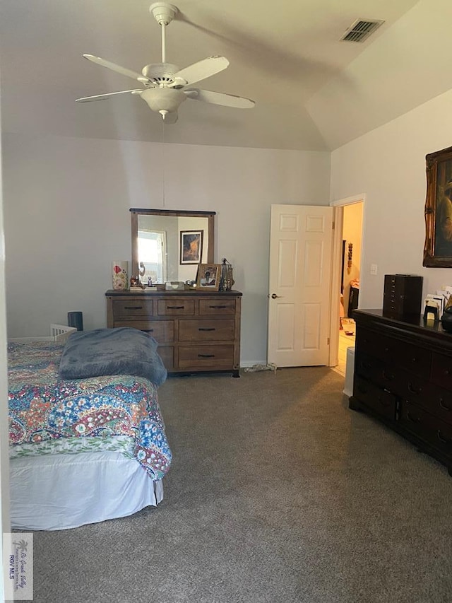 bedroom featuring ceiling fan, dark carpet, and lofted ceiling