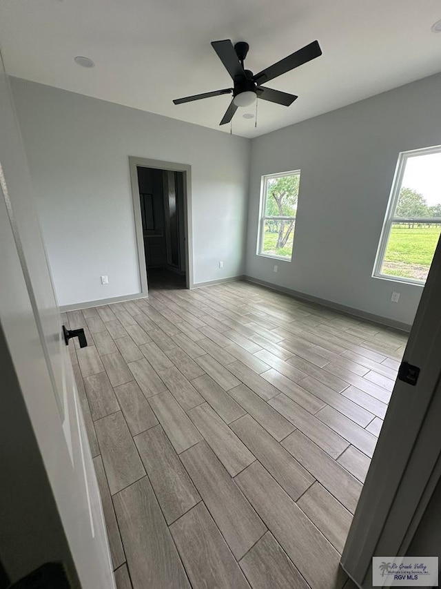 2914 Brushy Ct, Harlingen, TX 78552 - empty room with light wood-style flooring and ceiling fan