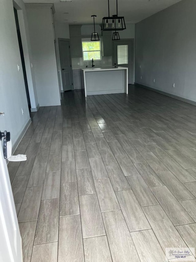 2914 Brushy Ct, Harlingen, TX 78552 - unfurnished living room with wood tiled floors