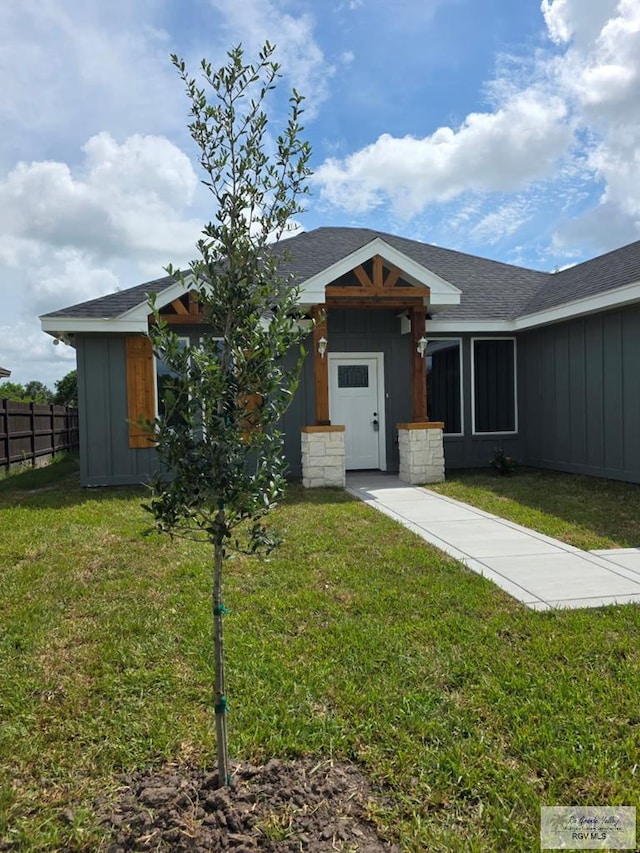 2914 Brushy Ct, Harlingen, TX 78552 - ranch-style house with board and batten siding and roof with shingles