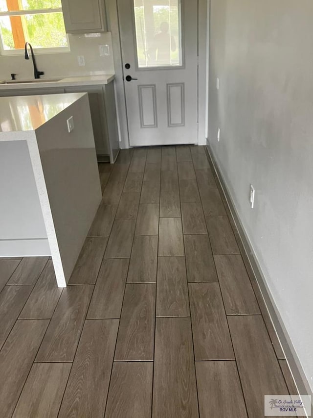 2914 Brushy Ct, Harlingen, TX 78552 - kitchen with wood tiled floors and light countertops
