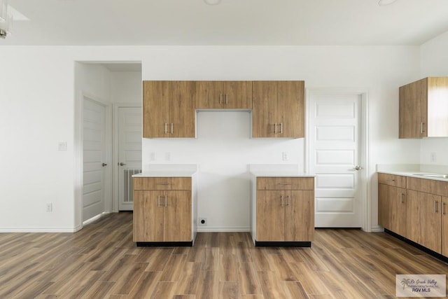 kitchen with dark hardwood / wood-style floors