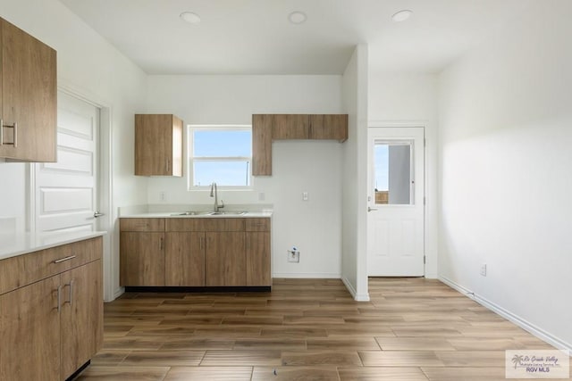 kitchen with dark hardwood / wood-style flooring and sink