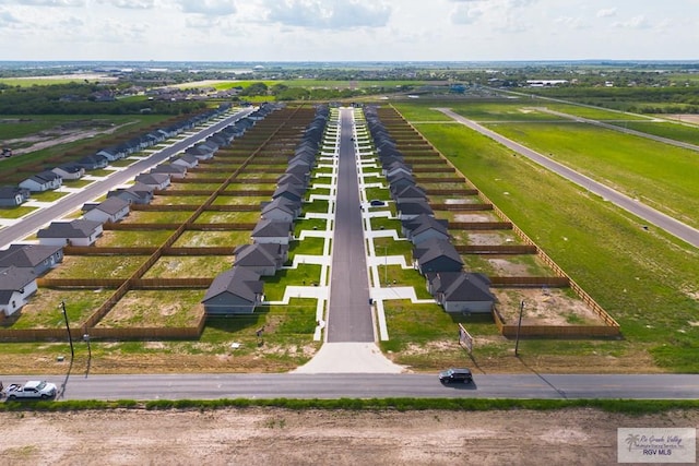 birds eye view of property with a rural view