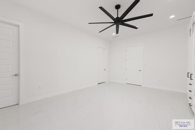 unfurnished room with ceiling fan