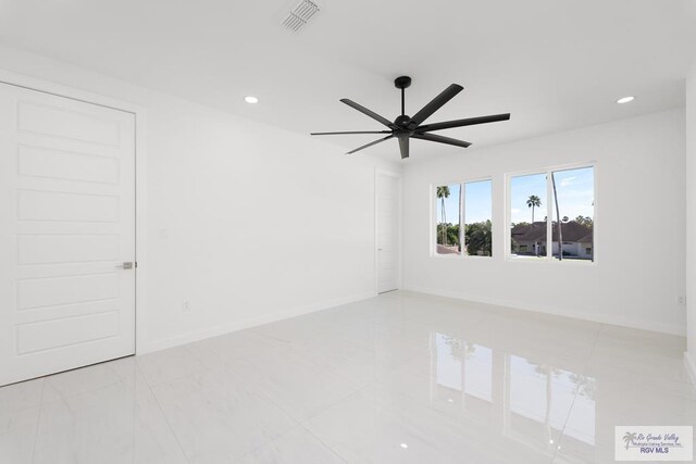 unfurnished room with ceiling fan