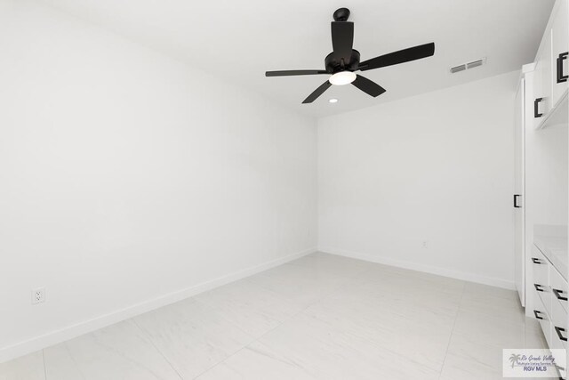 unfurnished room with ceiling fan