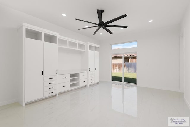 interior space featuring ceiling fan