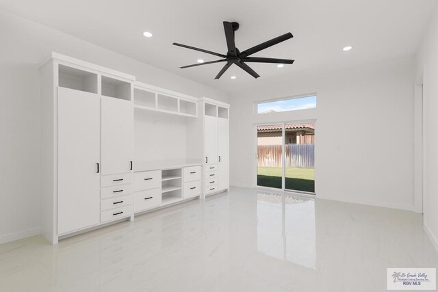 interior space featuring ceiling fan