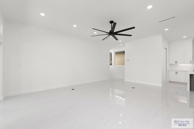 unfurnished room with ceiling fan