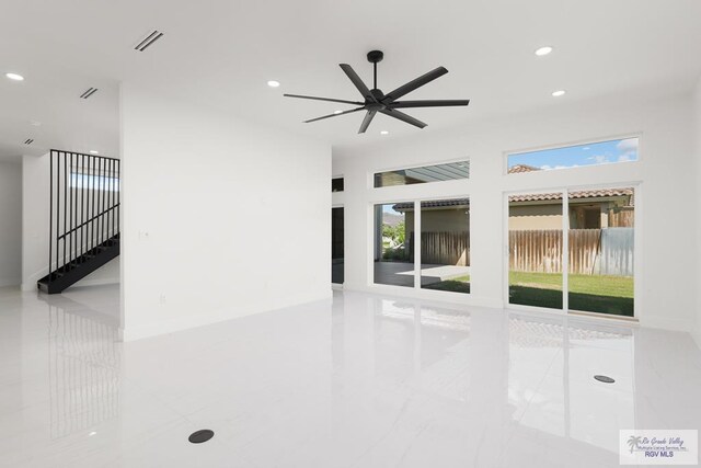 unfurnished room with ceiling fan