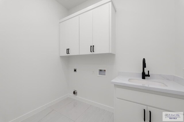 laundry area featuring cabinets, washer hookup, hookup for an electric dryer, and sink