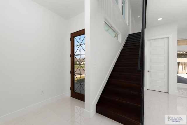 staircase featuring a healthy amount of sunlight