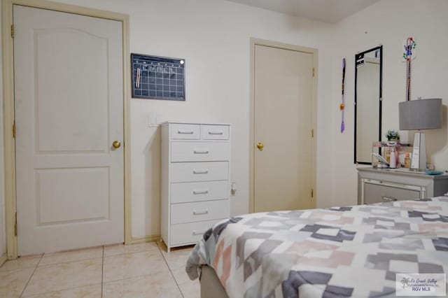 bedroom featuring light tile patterned flooring