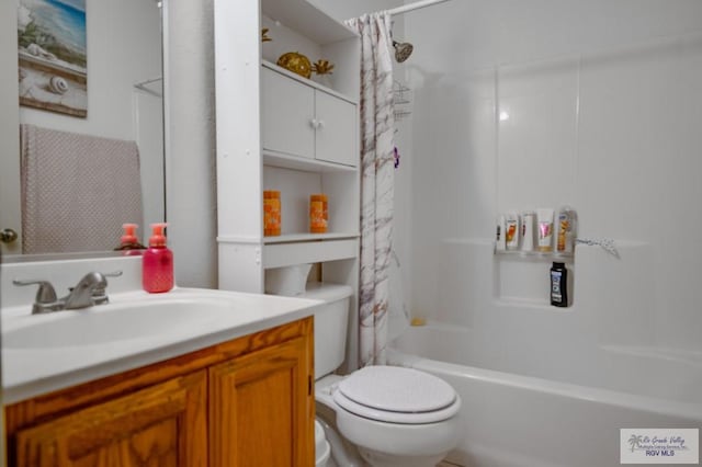 full bathroom featuring vanity, toilet, and shower / tub combo with curtain