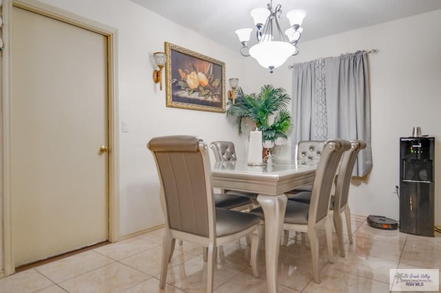 dining area featuring a notable chandelier