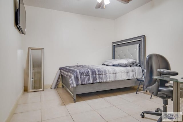 tiled bedroom with ceiling fan