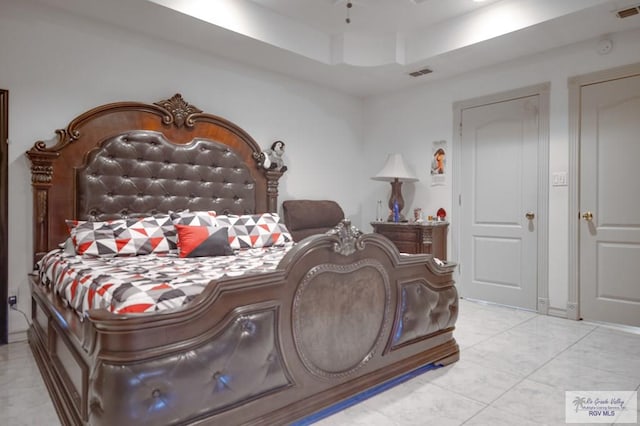 bedroom with a tray ceiling