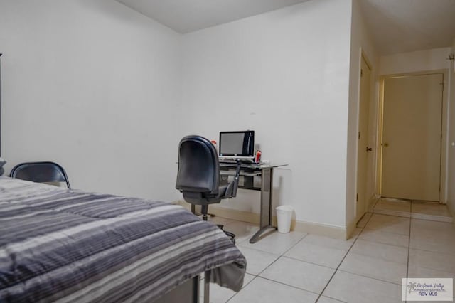 bedroom with light tile patterned flooring