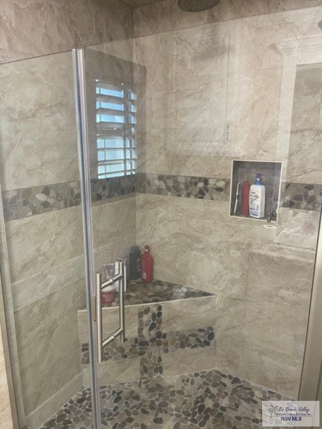 bathroom featuring an enclosed shower