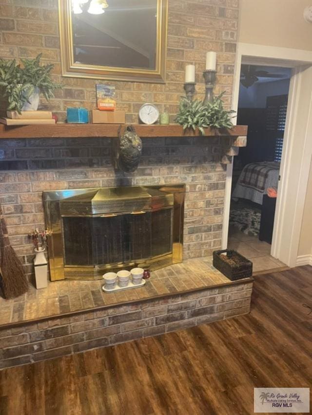 interior details with a fireplace and hardwood / wood-style flooring