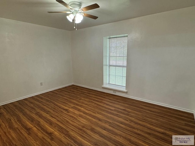 spare room featuring ceiling fan and dark hardwood / wood-style flooring