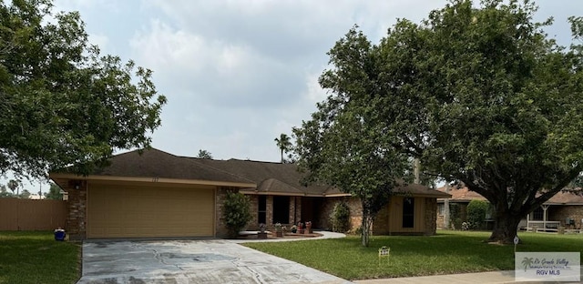 single story home with a front yard and a garage