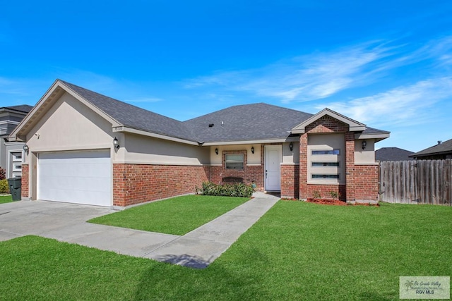 view of front of house with a front yard and a garage