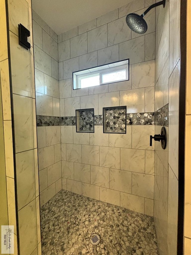 bathroom featuring tiled shower