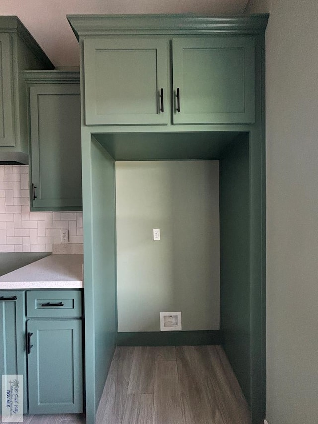 kitchen featuring backsplash and dark wood-type flooring