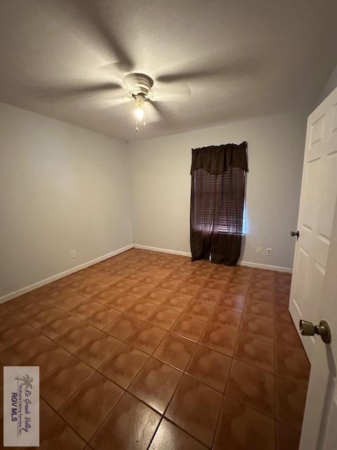 2226 E Austin Ave, Harlingen, TX 78550 - tiled empty room featuring a ceiling fan and baseboards