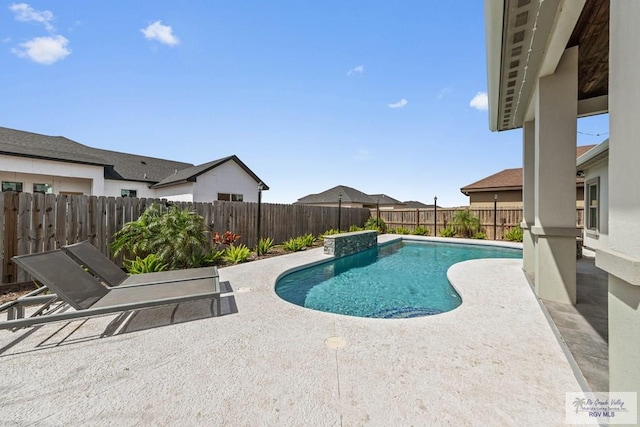 view of pool with a fenced backyard, a fenced in pool, and a patio