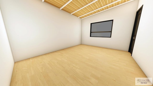 spare room with wood-type flooring, lofted ceiling, and wood ceiling