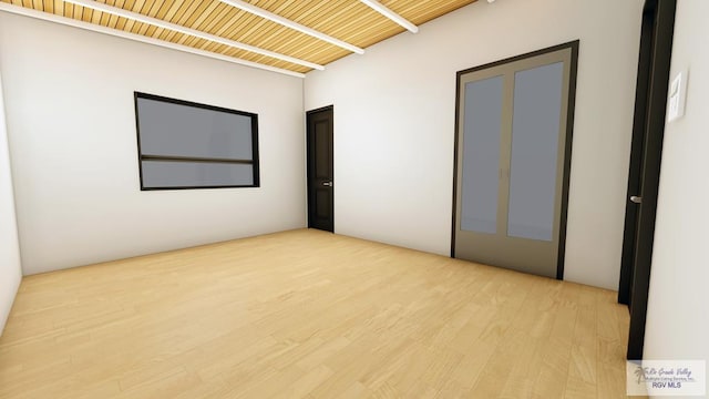 unfurnished room with light wood-type flooring