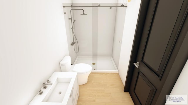 bathroom featuring vanity, toilet, wood-type flooring, and a shower with door