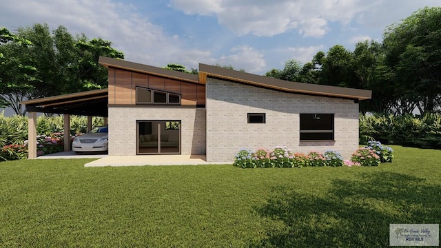 back of house with a carport and a lawn