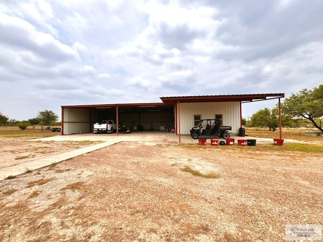 view of outdoor structure with a carport