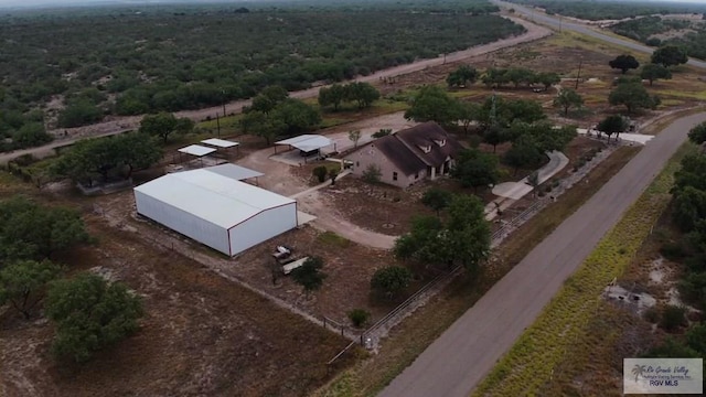 birds eye view of property featuring a rural view